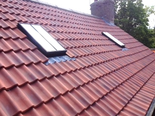 New roof with Velux windows and Santfoft Olympus Flanders clay tiles